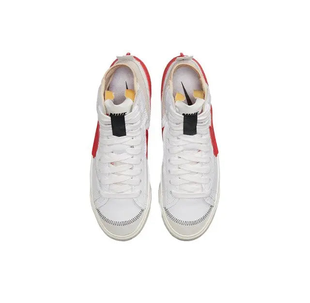 Pair of high-top sneakers with white uppers, red heel pull tabs, padded collar