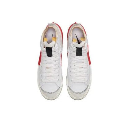 Pair of high-top sneakers with white uppers, red heel pull tabs, padded collar