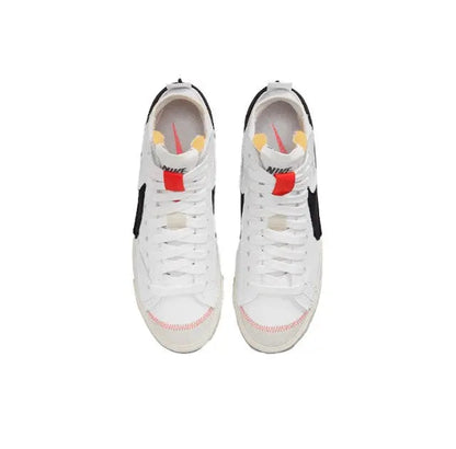 White Nike Blazer sneakers with red accents, lace-up and mesh tongue