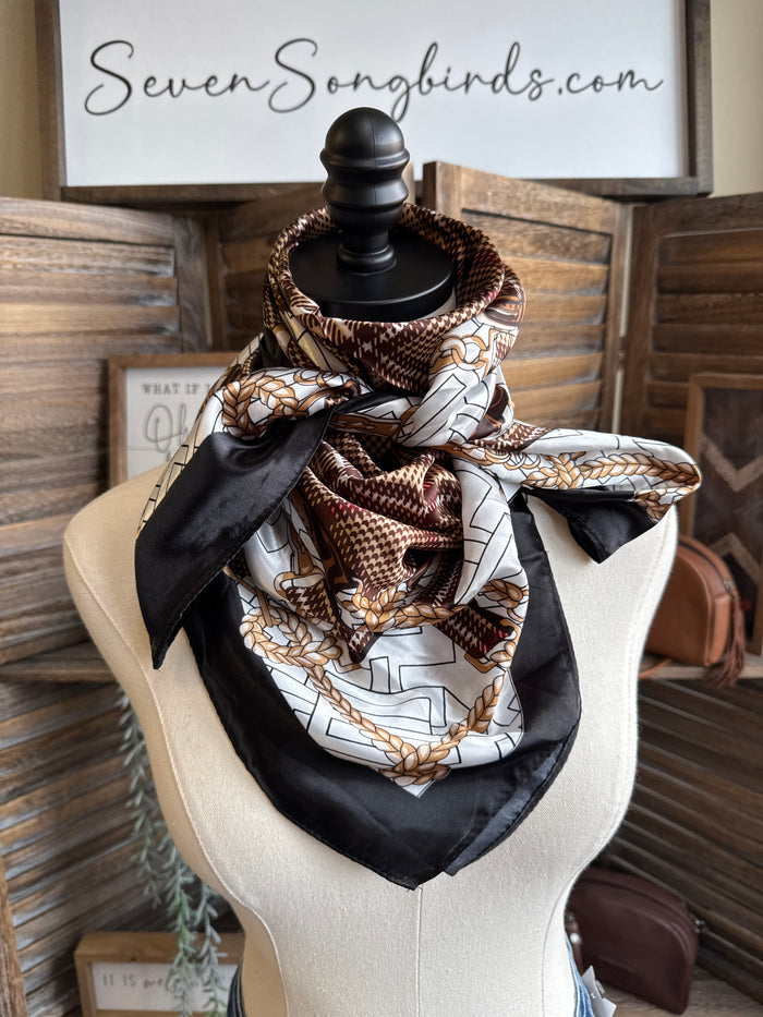 Bridle herringbone wild rag scarf with dark base, cream and brown print, black tails