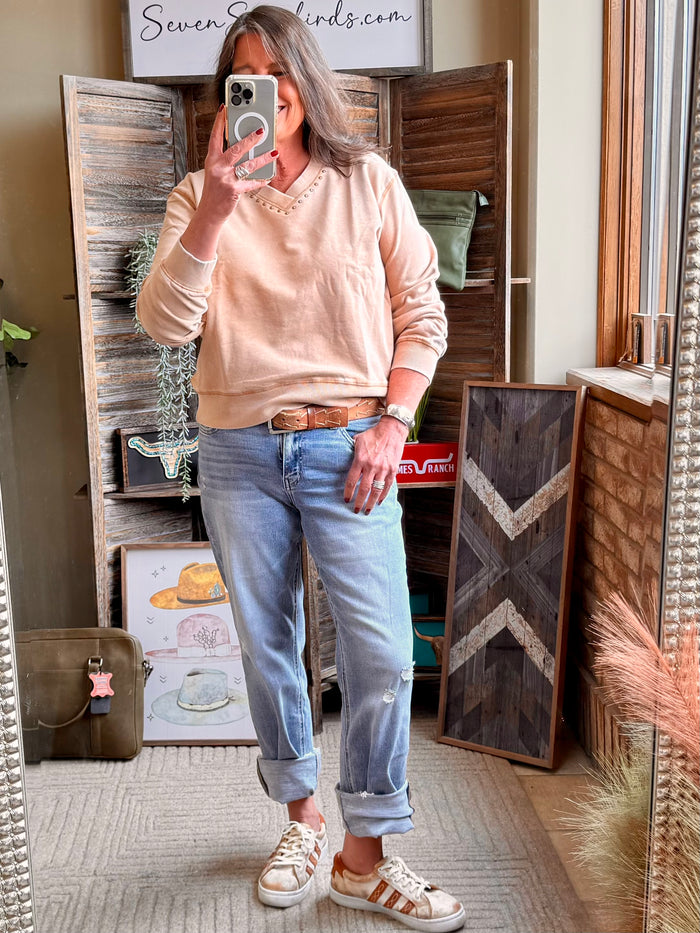 Light beige studded crewneck sweatshirt with long sleeves and ribbed hem