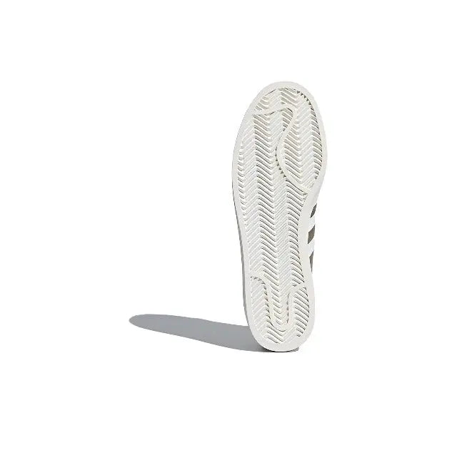Adidas Campus shoe outsole with textured pattern on white rubber sole