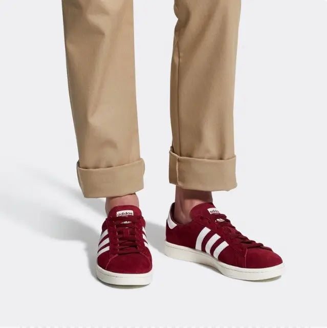 Burgundy Adidas Campus sneakers worn with khaki pants and cream soles