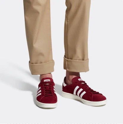 Burgundy Adidas Campus sneakers worn with khaki pants and cream soles