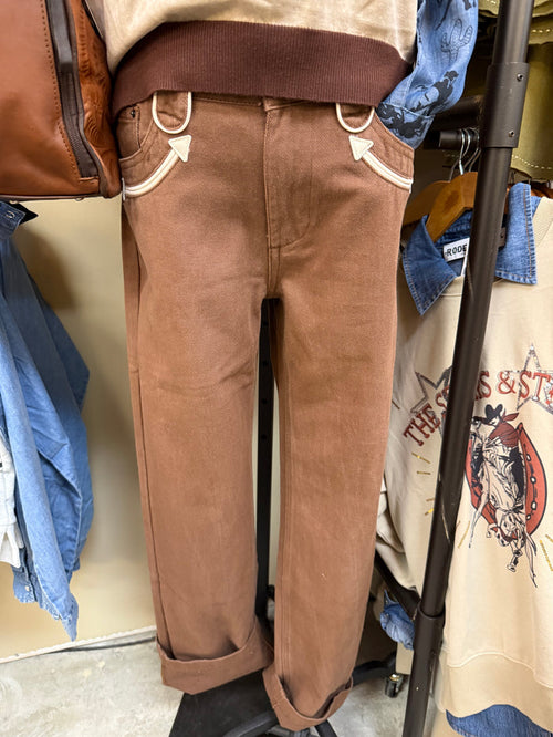 Brown straight-leg jeans with white-trim pockets and cream smiley details