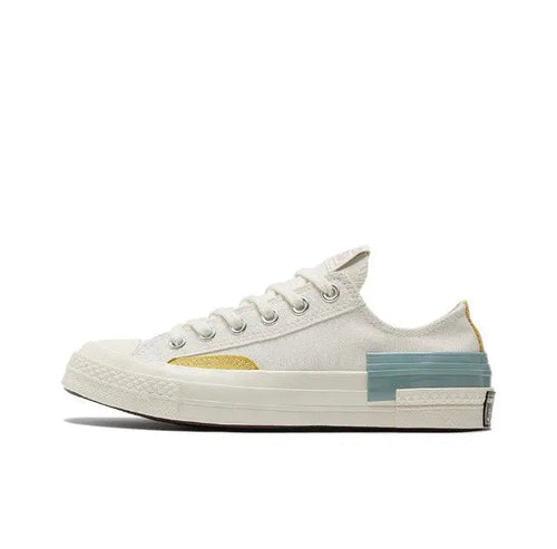 Converse Chuck 70 low-top sneakers, white canvas with yellow and blue accents