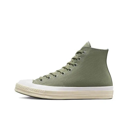 Olive green mid-top canvas sneaker with lace-up eyelets and white rubber sole