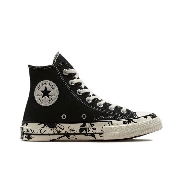 Black high-top canvas sneakers with white laces, ankle patch, and patterned sole