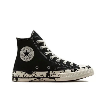 Black high-top canvas sneakers with white laces, ankle patch, and patterned sole