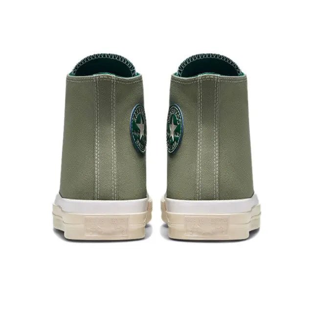 Olive green high-top canvas sneaker with rear ankle padding and white rubber sole