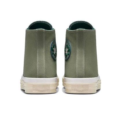 Olive green high-top canvas sneaker with rear ankle padding and white rubber sole