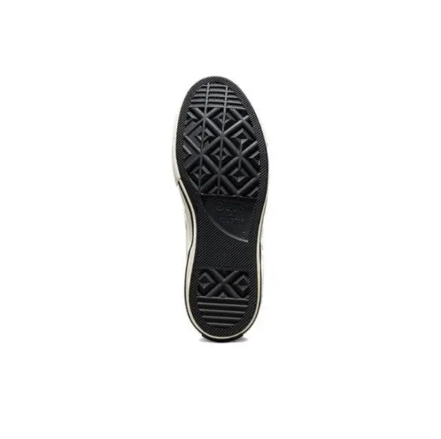 Black rubber outsole with patterned traction tread