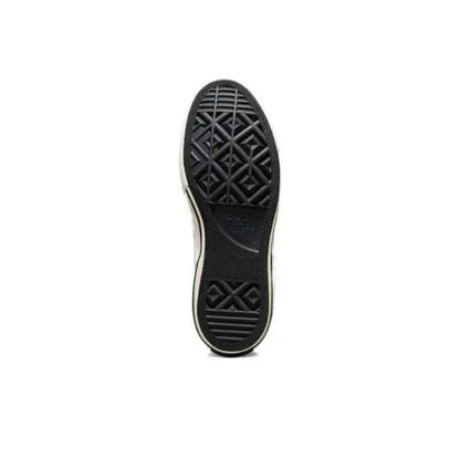 Black rubber outsole with patterned traction tread