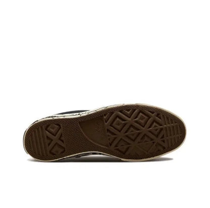 Rubber cupsole outsole with textured tread in dark brown