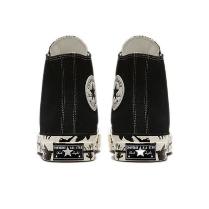 Black high-top canvas sneakers with rear All Star patch and patterned toe cap