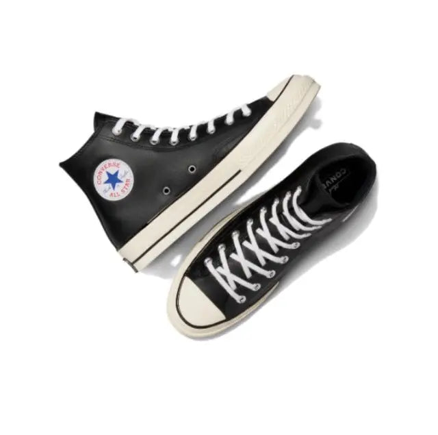 Converse Chuck 70's high-top sneakers pair, black upper with white sole and laces