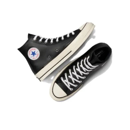 Converse Chuck 70's high-top sneakers pair, black upper with white sole and laces