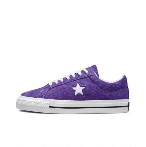 Purple low-top sneakers with white star emblem and white rubber sole edge