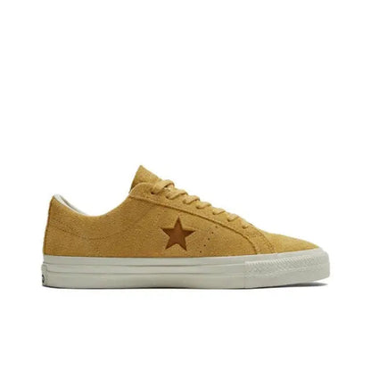 Yellow suede low-top sneaker with star logo and white rubber sole