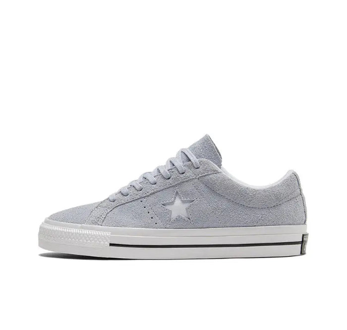 Light grey low-top sneakers with star logo and white rubber sole