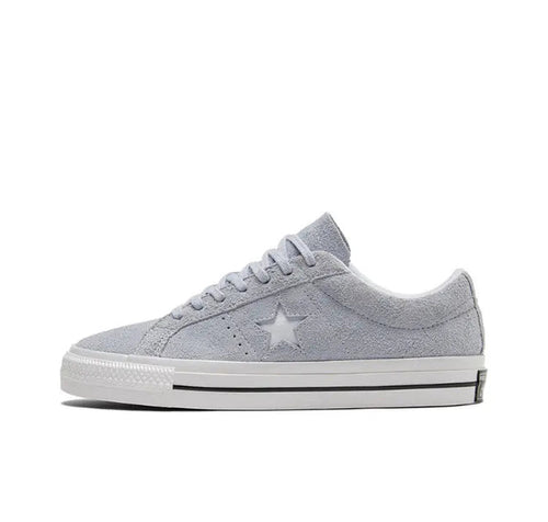 Light grey low-top sneakers with star logo and white rubber sole