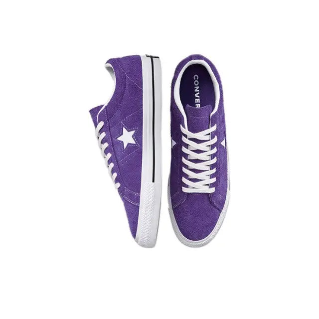 Pair of purple low-top sneakers shown side-by-side with white laces and star patches