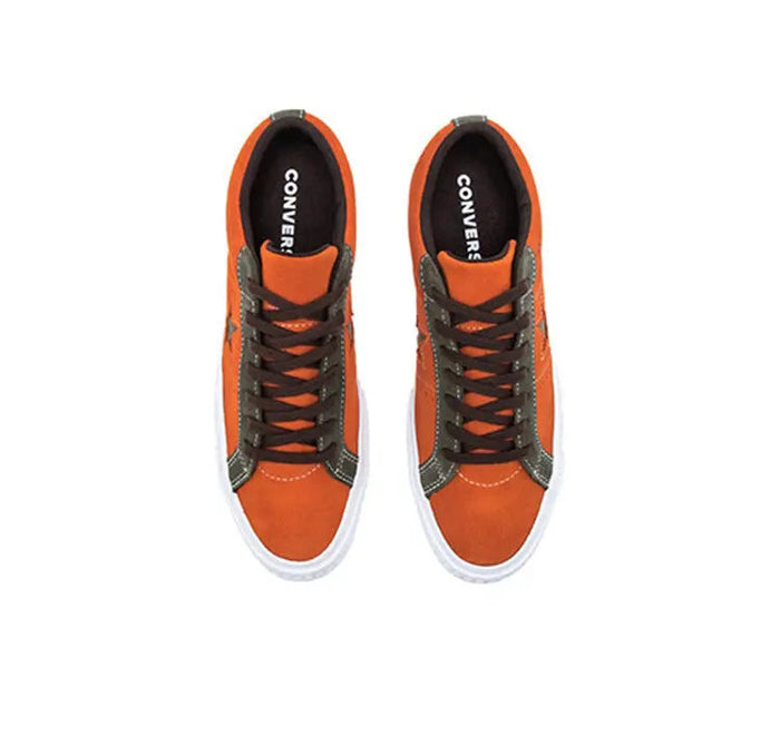 Pair of orange low-top Converse One Star Pro sneakers, black lining, white rubber sole