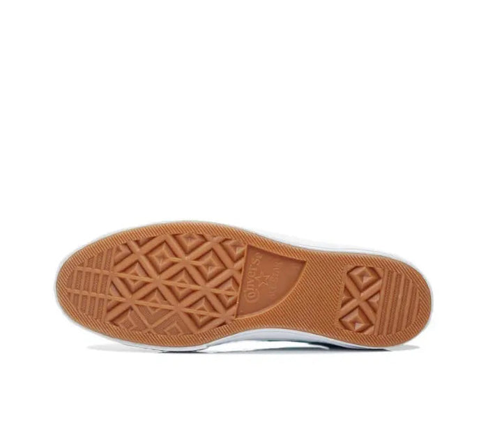 Outsole of light blue low-top sneakers with geometric rubber tread and brown heel