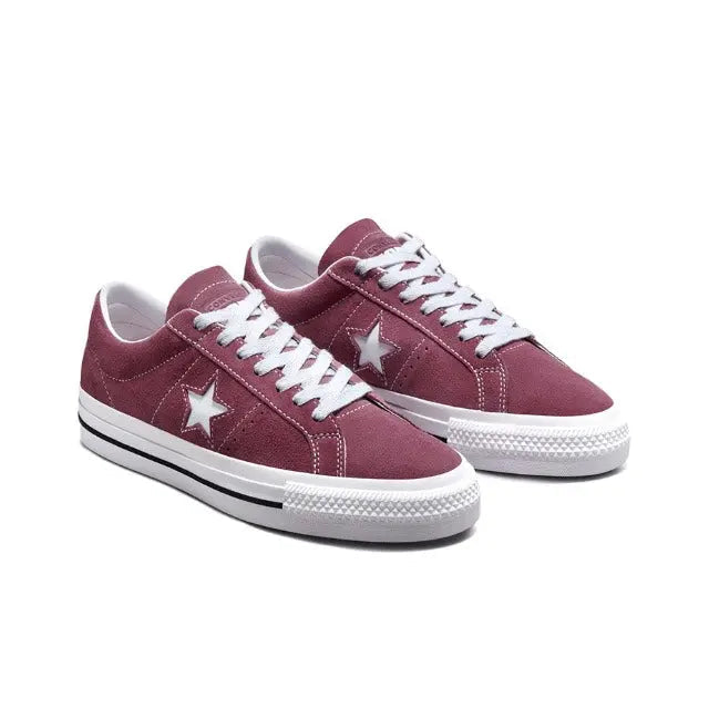 Pair of burgundy low-top sneakers with white laces, star logos, and rubber soles