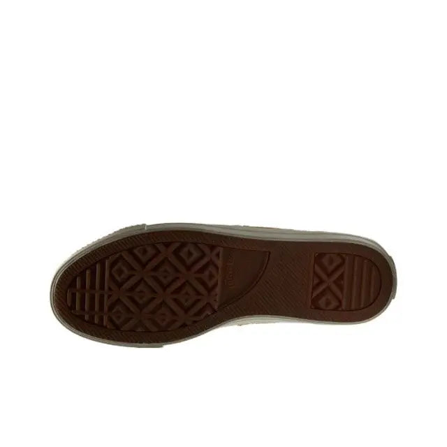 Low-top sneaker outsole with dark patterned rubber tread