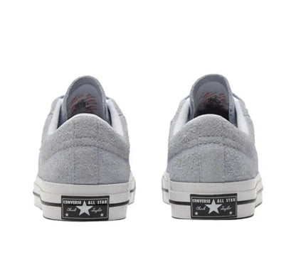 Light grey low-top sneakers rear view with heel All Star patch