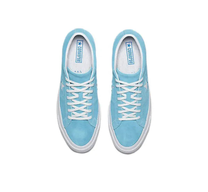 Pair of light blue low-top sneakers with white laces and star logo on tongue