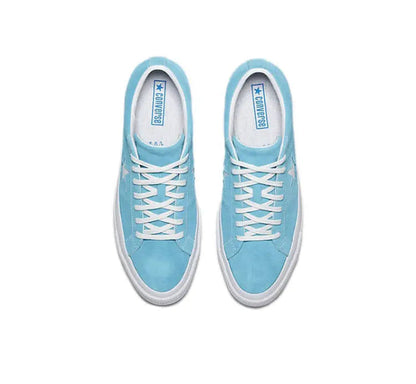 Pair of light blue low-top sneakers with white laces and star logo on tongue