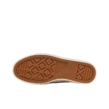 Converse orange sneaker outsole with textured tread and X-pattern details