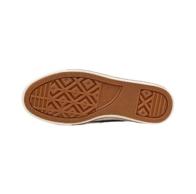 Brown rubber outsole with traction pattern and embossed star