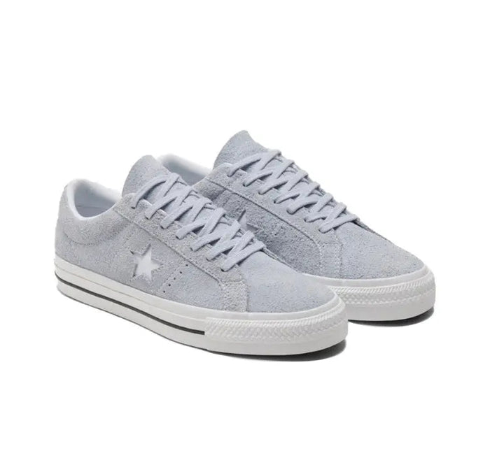 Light grey low-top sneakers with lace-up front and star logo