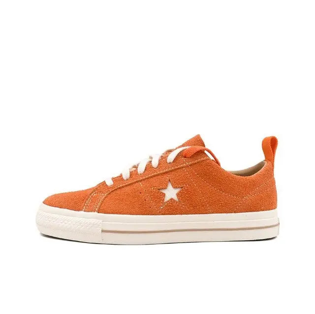 Converse orange low-top sneaker, laces and star emblem on side panel