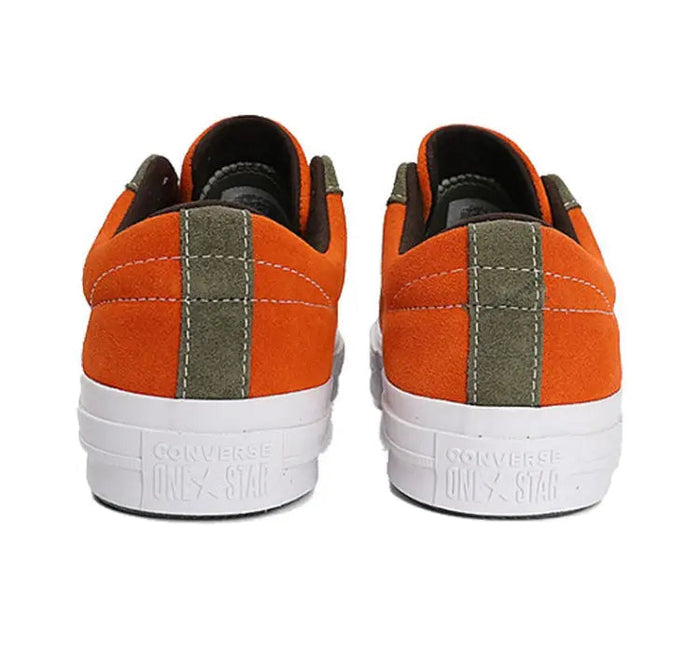 Orange One Star Pro sneakers with black heel collar and gray side panel, white sole
