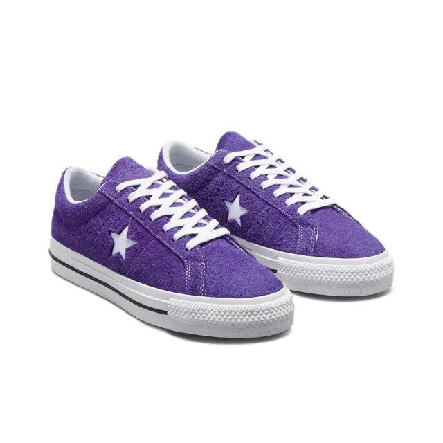 Purple low-top sneakers with white laces, white star details, and gray cupsole