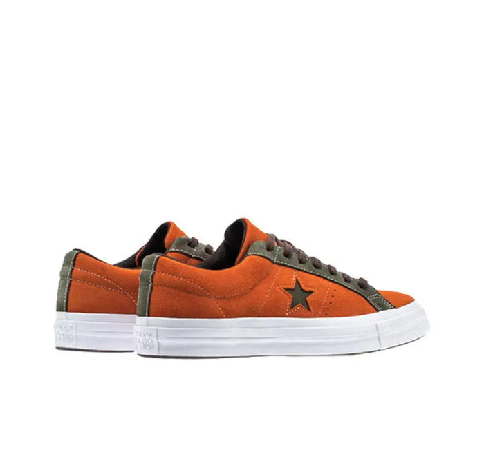 Orange One Star Pro low-top sneakers, black star patch, black laces, white rubber sole
