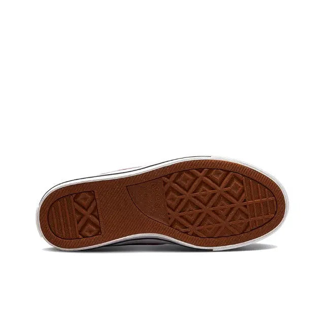 Rubber cupsole outsole with brown tread pattern for grip