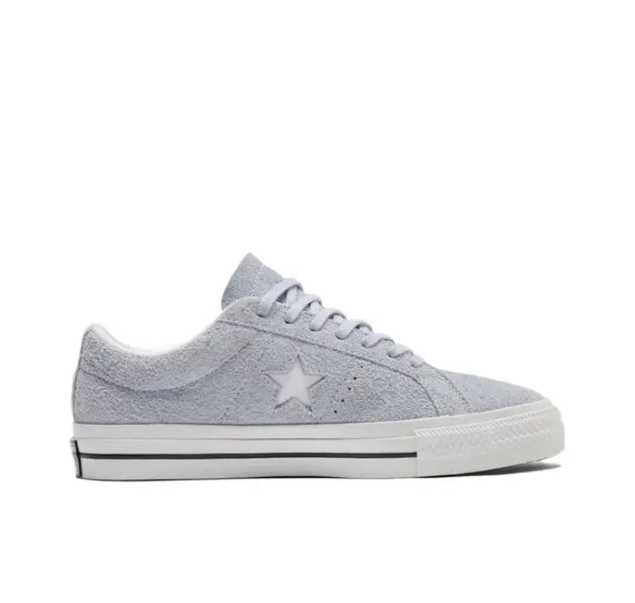 Light grey low-top sneakers with side star emblem and white sole