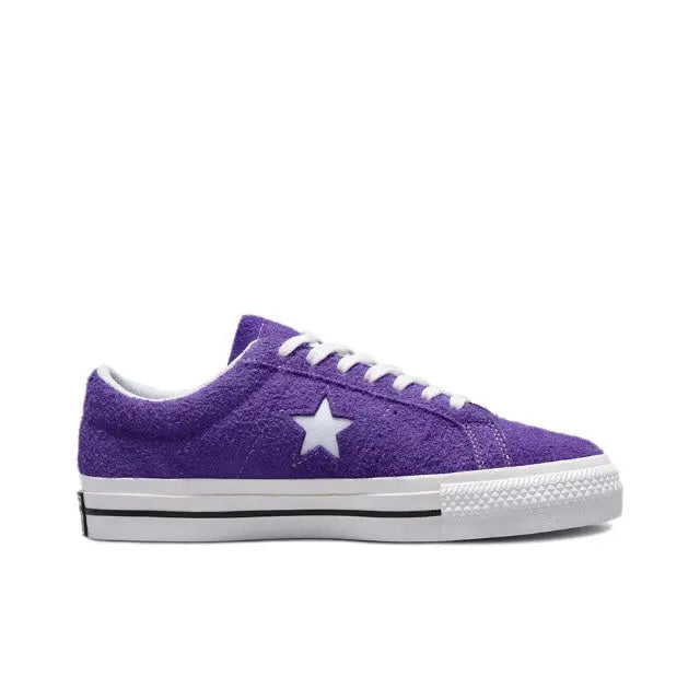 Purple low-top sneaker with white star logo, white laces, and textured sidewall