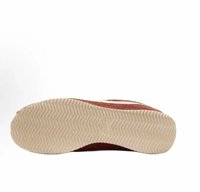 Cortez SE sneaker outsole, light herringbone tread with dark russet upper