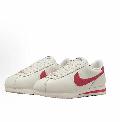 Cortez SE low-top sneakers in white with red Swoosh and lace eyelet stitching