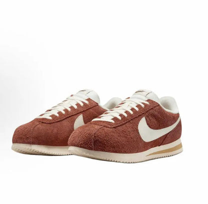 Cortez SE low-top sneakers, dark russet suede with white Swoosh and cream sole