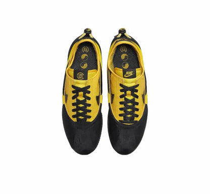Cortez x Clot sneakers pair, black uppers with yellow tongue and laces