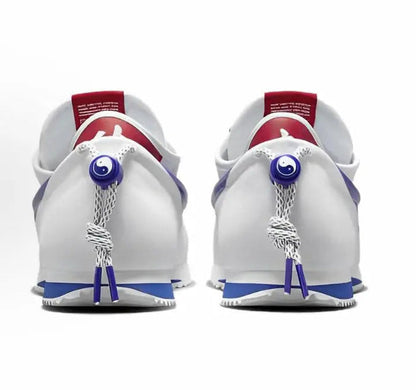 Nike Cortez x Clot sneakers, back view with red collars and blue lace tassel ties