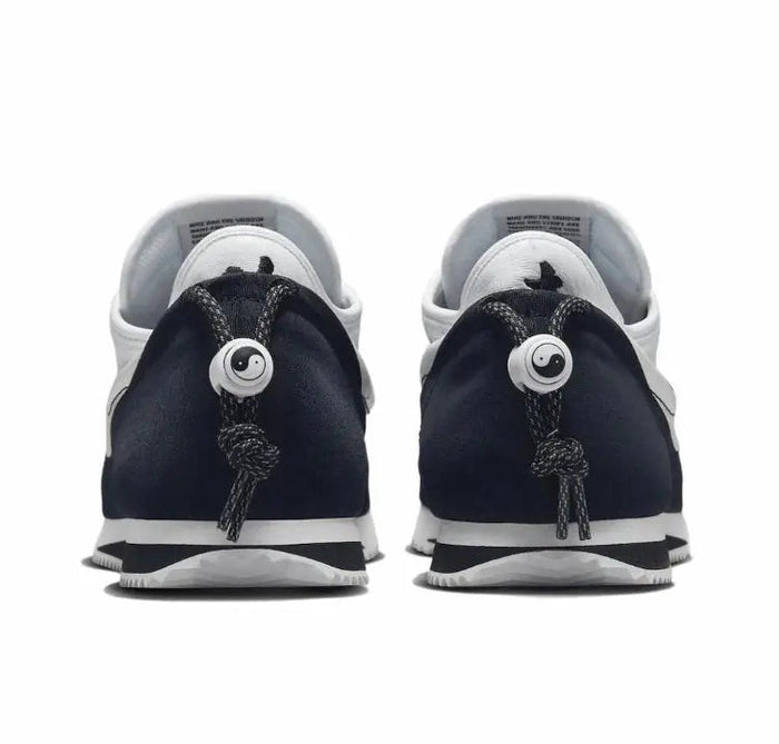 Nike Cortez x Clot sneakers with rear view, dark navy uppers and white lining