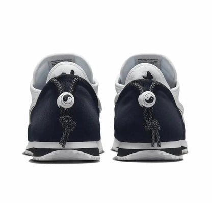 Nike Cortez x Clot sneakers with rear view, dark navy uppers and white lining